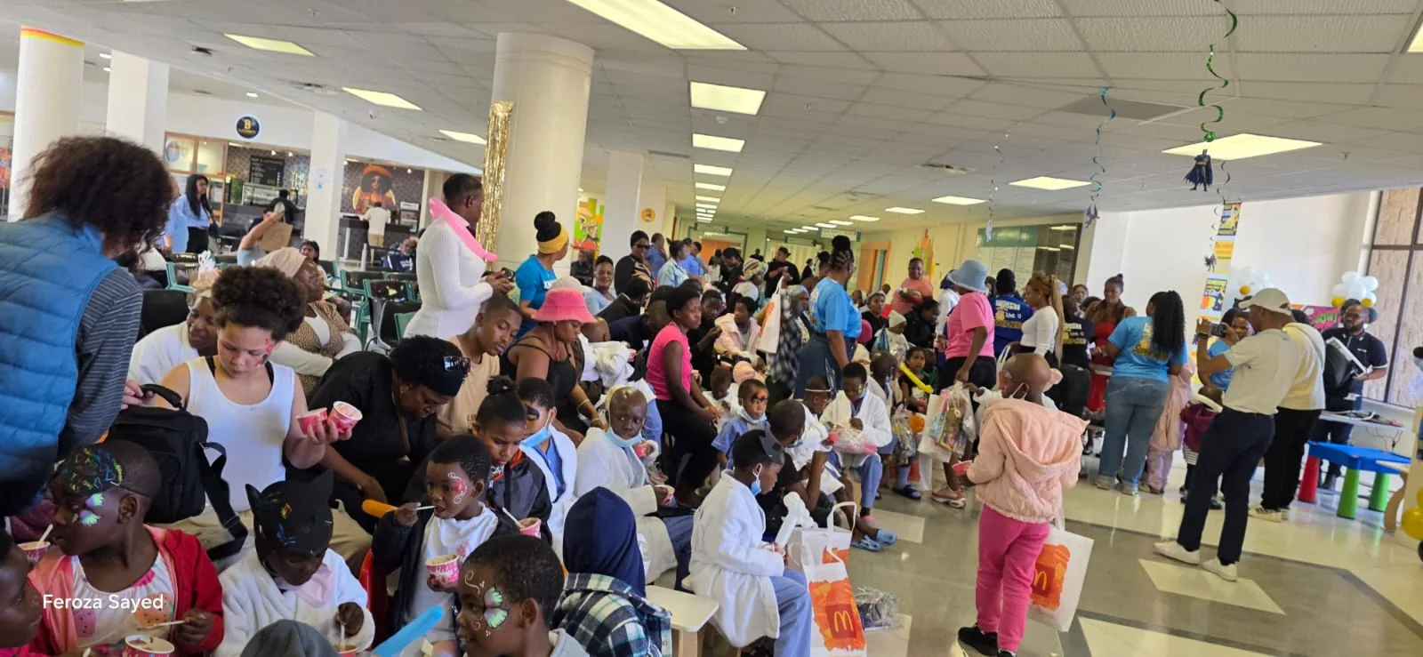 Families and children taking part in a community gathering