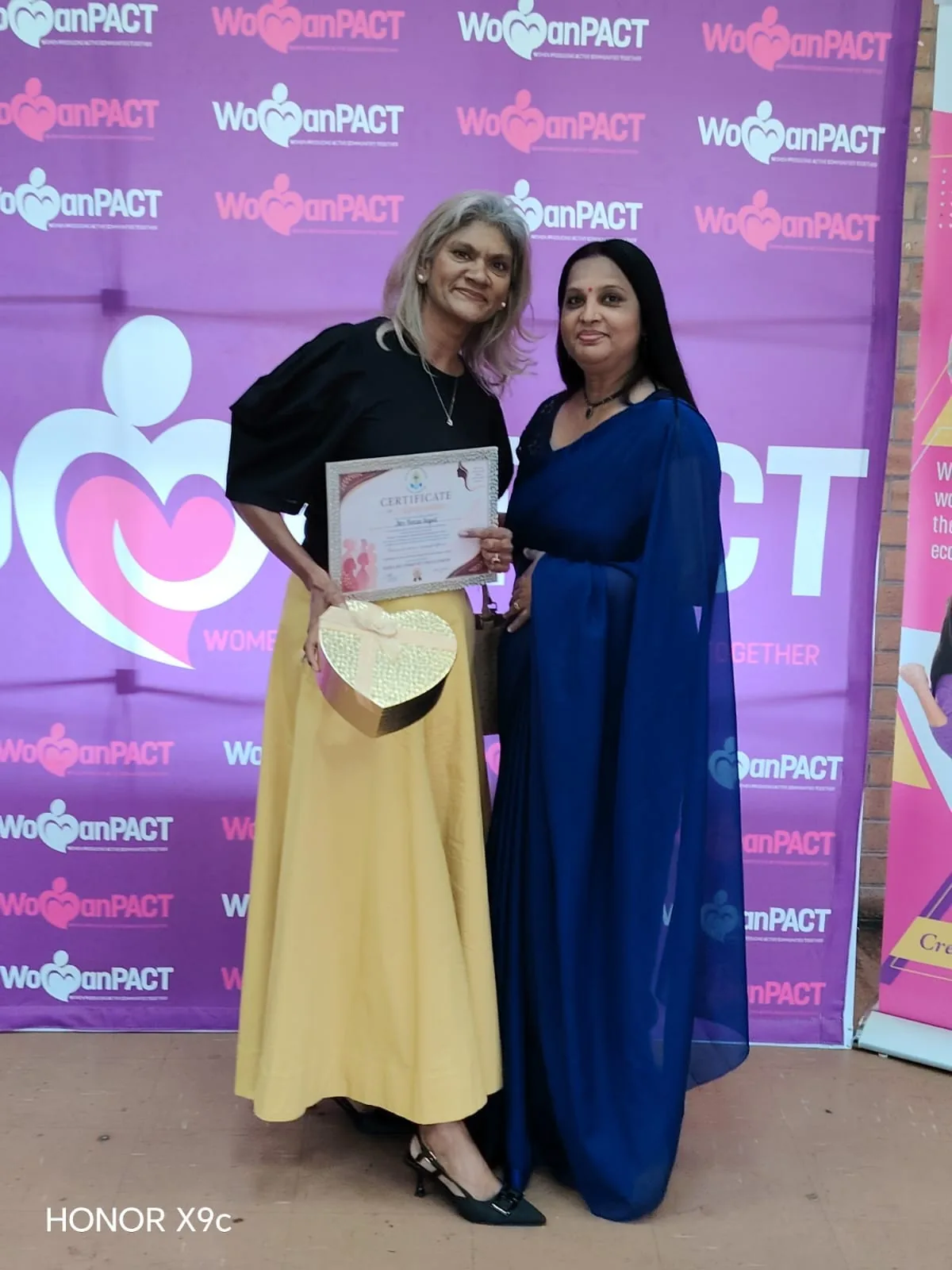 A recognition moment at a women’s event