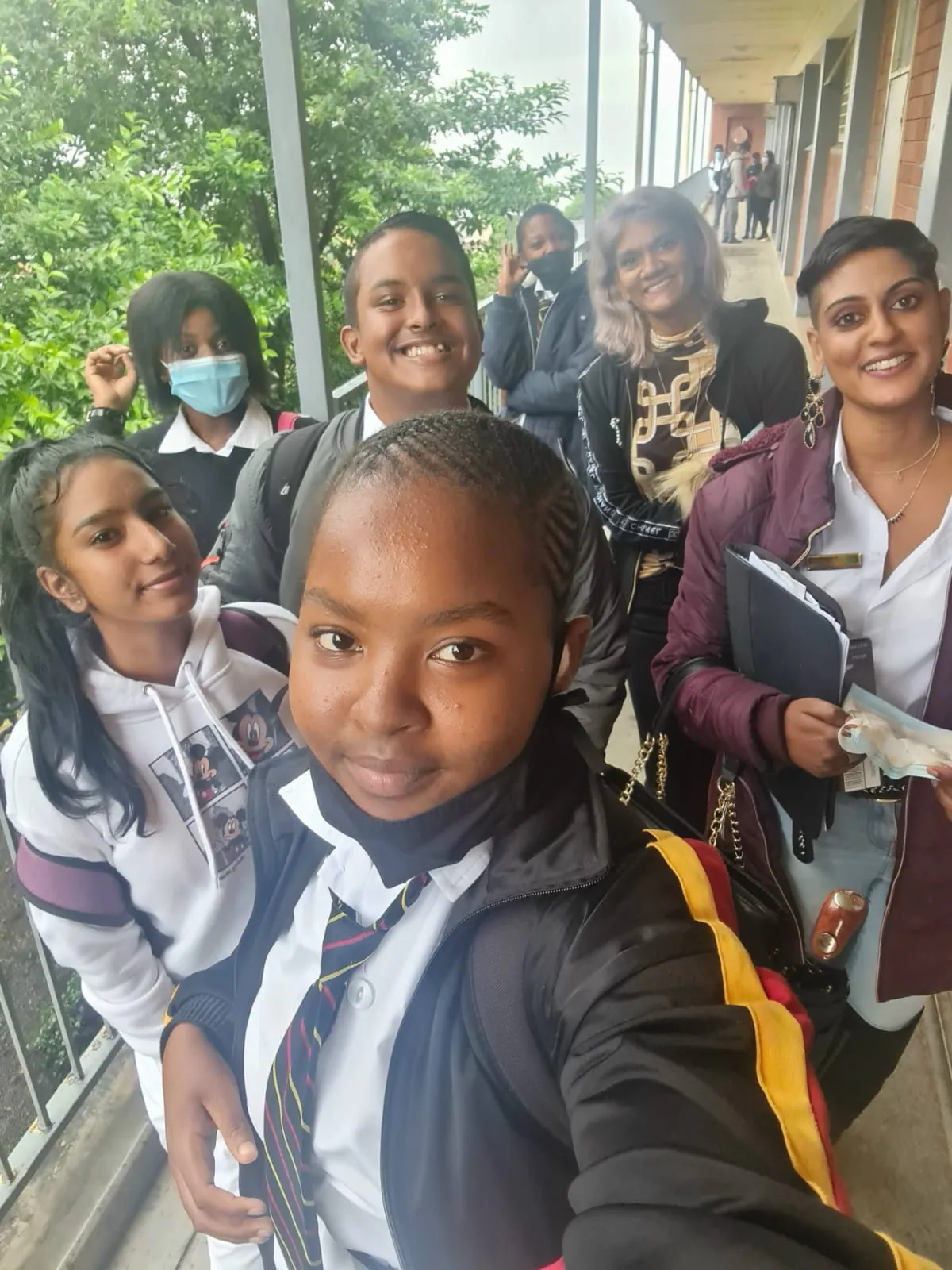 Learners and community volunteers smiling together